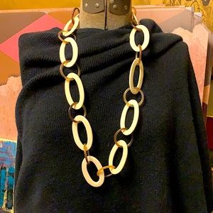 Oval rings of bone and amber lucite